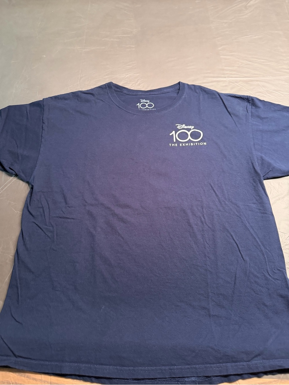 Disney 100 the exhibition Navy V-Neck Logo Tee